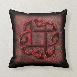 Dark red celtic knot on leather throw pillow