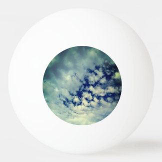 Dark sky , peeping through the clouds ping pong ball