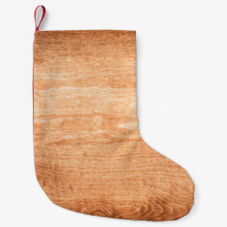 Dark wood texture background surface with old natu small christmas stocking