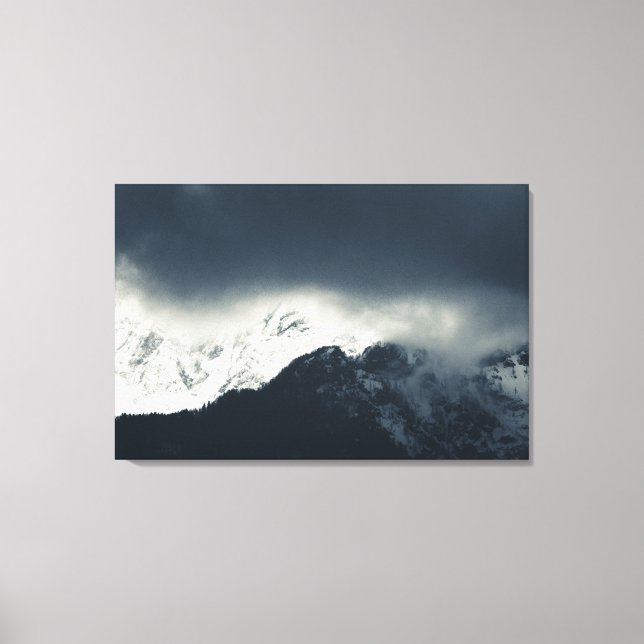 Darkness and light on snow covered mountains canvas print (Front)