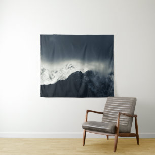 Darkness and light on snow covered mountains tapestry