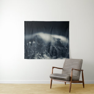 Darkness and white clouds over the mountains tapestry