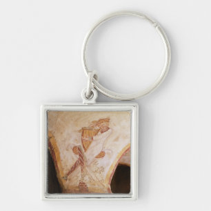 David playing on the harp keychain