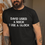 David Used a Rock I use a Glock T-Shirt<br><div class="desc">This design may be personalized in the area provided by changing the photo and/or text. Or it can be customized by clicking Personalize this Template and then choosing the click to customize further option and delete or change the colour of the background, add text, change the text colour or style,...</div>