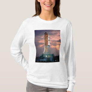 Dawn breaks behind ASTP Saturn IB CDDT T-Shirt