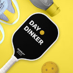 Day Dinker Custom Text Name Funny Pickleball Paddle<br><div class="desc">This funny pickleball paddle reads "DAY DINKER" in a bold white text that's set against a black background and highlighted by a yellow pickleball (you can easily change the background colour). Add 2 lines of custom text to personalize - club name, location, player's name, phone number, etc. Or delete. Makes...</div>