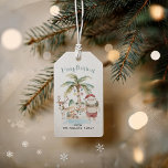 Deck the Palms | Fun Tropical Christmas Gift Tags<br><div class="desc">Get ready to spread some festive cheer with these Deck the Palms | Fun Tropical Christmas Gift Tags! Perfect for adding a playful and beachy twist to your holiday presents, these tags feature an adorable tropical Santa, a palm tree decorated with ornaments, and fun-loving reindeer in a relaxing island setting....</div>