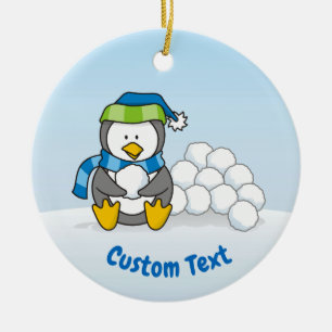 Décoration En Céramique Petit pingouin assis avec des boules de neige