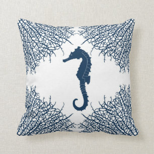 Decorative throw pillow with seahorse and coral