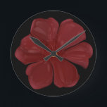 Deep Crimson Moody Bloom Glossy Dark Botanical Flo Round Clock<br><div class="desc">Embrace the drama of nature with this deep crimson bloom. This striking digital illustration features a bold red flower with a high-gloss, almost porcelain finish, set against a deep, moody background. Perfect for lovers of dark botanical art, gothic garden aesthetics, and moody floral decor. This piece captures a sense of...</div>