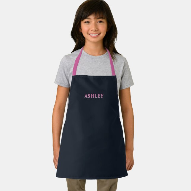 Deep navy pink custom name kids apron (Insitu)