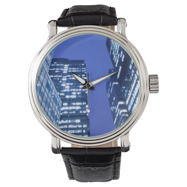 Defocused upward view of office building windows watch (Front)