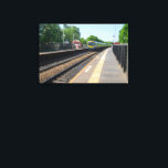 Deighton Railway Station, Huddersfield Canvas Print<br><div class="desc">This dynamic photo captures a TransPennine Express train as it speeds through Deighton Railway Station in West Yorkshire. The clear blue sky and lush green trees highlight the classic British railway scene, making it a perfect piece for trainspotters, commuters, and lovers of UK transport. A fantastic addition to any product,...</div>