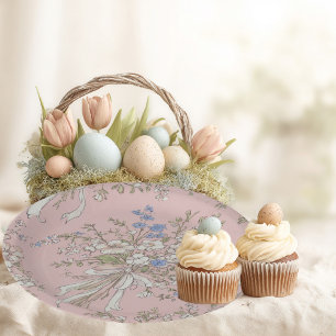 Delicate bouquet of wild flowers on a pink backgro paper plate