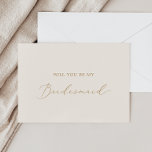 Delicate Gold and Cream Bridesmaid Proposal Card<br><div class="desc">This delicate gold and cream bridesmaid proposal card is perfect for a modern wedding. The romantic minimalist design features lovely and elegant champagne golden yellow typography on an ivory cream background with a clean and simple look. Customize the card with the name of the bride and the bridesmaid. Personalize the...</div>