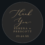 Delicate Gold Black Thank You Favour Sticker<br><div class="desc">These delicate gold and black thank you favour stickers are perfect for a modern wedding reception. The romantic minimalist design features lovely and elegant champagne golden yellow typography on a black background with a clean and simple look. Personalize the sticker labels with your names, the event (if applicable), and the...</div>