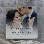 Delicate Newlywed First Christmas Wedding Photo Ceramic Ornament<br><div class="desc">This delicate newlywed first Christmas wedding photo ceramic ornament is the perfect modern Christmas tree decoration. The romantic minimalist design features lovely and elegant black typography with a clean and simple look. This keepsake ornament reads "our first Christmas as mr and mrs". Personalize your double-sided ornament with a wedding photo,...</div>