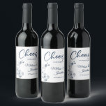 Delicate orchid cheers to the wedding blue custom wine label<br><div class="desc">Elegant customizable wine labels for your wedding reception, featuring beautiful and delicate Prussian blue orchids line drawing on one side, over a classic white background, and the wording "Cheers to the wedding of" in dark blue fonts. Easily edit the template fields to add the bride and groom names in a...</div>