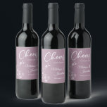 Delicate orchid cheers to wedding purple custom wine label<br><div class="desc">Elegant customizable wine labels for your wedding reception, featuring beautiful and delicate white orchids line drawing on one side, over a romantic dusty purple background, and the wording "Cheers to the wedding of" in white fonts. Easily edit the template fields to add the bride and groom names in a classy...</div>