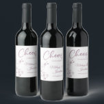 Delicate orchid cheers to wedding purple custom wine label<br><div class="desc">Elegant customizable wine labels for your wedding reception, featuring beautiful and delicate pastel purple orchids line drawing on one side, over a classic white background, and the wording "Cheers to the wedding of" in purple fonts. Easily edit the template fields to add the bride and groom names in a classy...</div>