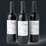 Delicate orchid cheers to wedding purple custom wine label<br><div class="desc">Elegant customizable wine labels for your wedding reception, featuring beautiful and delicate periwinkle purple orchids line drawing on one side, over a classic white background, and the wording "Cheers to the wedding of" in purple fonts. Easily edit the template fields to add the bride and groom names in a classy...</div>