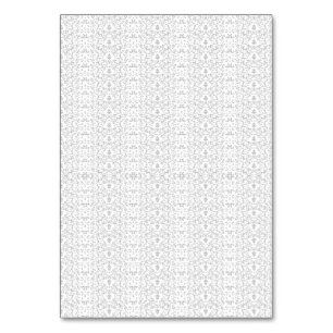 Delicate, repeating light grey floral pattern on a table number