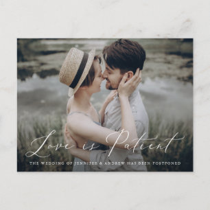 Delicate Script Love is Patient Change the Date Announcement Postcard