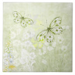 Delicate White Butterflies on Soft Green Tile<br><div class="desc">White butterflies float on a background of soft green with pale white flowers.</div>