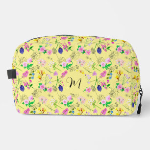 Delicate wildflowers in light yellow dopp kit