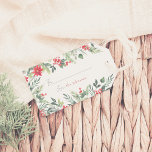 Delicate Winter Foliage Family Name Christmas Gift Tags<br><div class="desc">A delicate Christmas holiday gift tag design. The front of the tag features a hand-painted watercolor frame of winter botanicals including bright red berries, holly, lush greenery leaves, and pine boughs. In the middle of the card, your family name is written in red typography. You can personalize each tag by...</div>