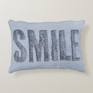 denim smile with red stitching decorative pillow
