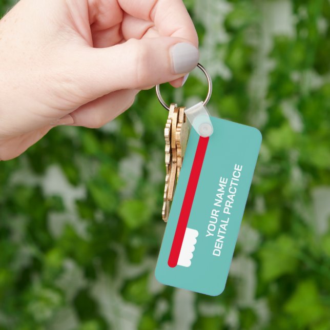 Dentist office keychain with red toothbrush logo (Hand)