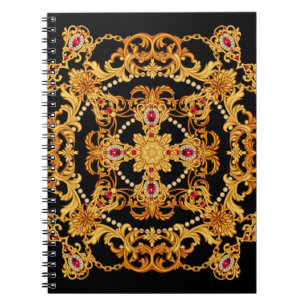Design of silk scarf with ruby gem stones and gold notebook