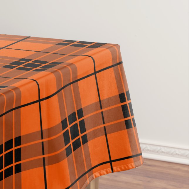 Designer plaid pattern orange and black tablecloth (In Situ)