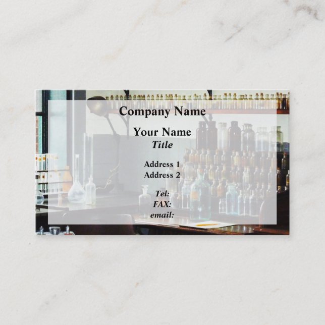 Desk With Bottles of Chemicals Business Card (Front)
