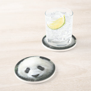 Dessous De Verre En Grès Panda géant se reposant dans l'herbe verte