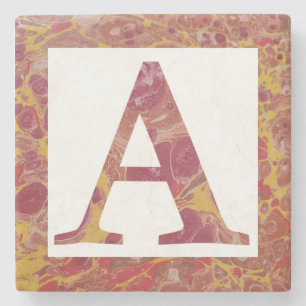 Dessous-de-verre En Pierre Monogramme marbré en pierre rouge et jaune A