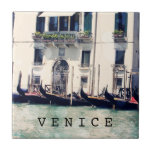 Destinations | Venice Waterfront Photograph Tile<br><div class="desc">Captured here, a stunning classic photograph along the Venice canals in Italy by the talented Sylvia Coomes. Take in all the wonderful rustic details of this photograph starting with the row of sleek gondolas lined up. Look as the blistering sun blissfully shines down as the water stands still. The vintage...</div>
