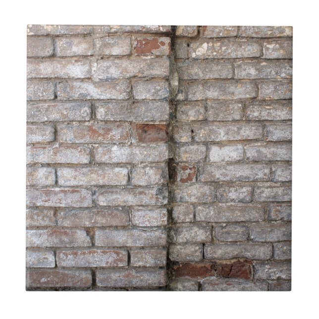 Detail of a wall of an old red brick with white co tile (Front)