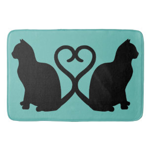 Deux chats dans le tapis de bain de silhouette