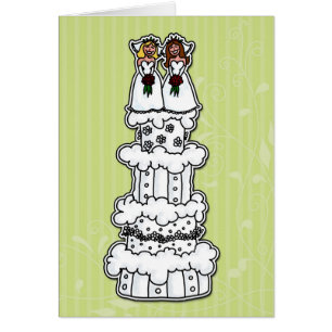 Deux jeunes mariées sur le gâteau de mariage