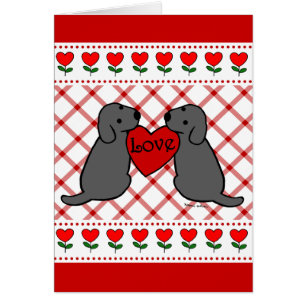 Deux Labradors noir avec la bande dessinée d'amour