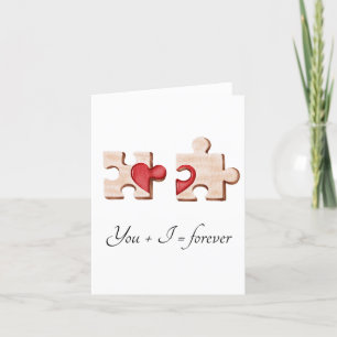 deux pièces de puzzle assorties avec une carte à c