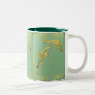 Deux tasses de dauphins d'or