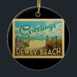 Dewey Beach Vintage Travel Ceramic Ornament<br><div class="desc">This Greetings From Dewey Beach vintage postcard design features a sandy beach with a beautiful turquoise ocean water and above the sea, a blue sky with billowy white clouds. In vintage travels style.</div>