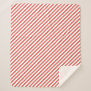 Diagonal pattern of pink and white stripes sherpa blanket