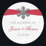 Diamante Snowflake & Red Ribbon Winter Wedding Classic Round Sticker<br><div class="desc">The diamante snowflake & red ribbon wedding collection is perfect for any couple planning a romantic winter wedding celebration. The design features a light silvery grey and white snowflake textured background with a diamante snowflake on top of a silky looking ribbon. The wording incorporates the same silvery grey and red...</div>
