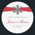Diamante Snowflake & Red Ribbon Winter Wedding Classic Round Sticker<br><div class="desc">The diamante snowflake & red ribbon wedding collection is perfect for any couple planning a romantic winter wedding celebration. The design features a light silvery grey and white snowflake textured background with a diamante snowflake on top of a silky looking ribbon. The wording incorporates the same silvery grey and red...</div>