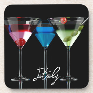 Different cocktails in martini glasses on black coaster