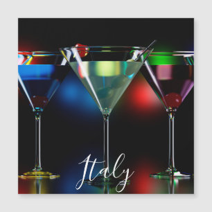 Different cocktails in martini glasses with lights